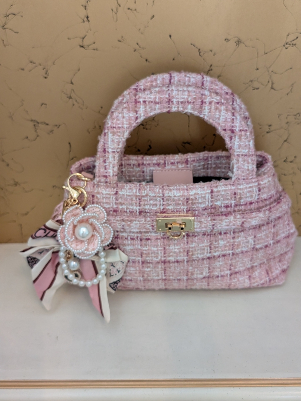 Stylish Pink Tweed Mini Top-Handle Bag with Floral Charm